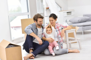 47873035 - young family moving into new home