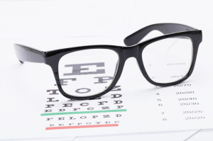 58134118 - table for eyesight test and glasses over it - studio shot